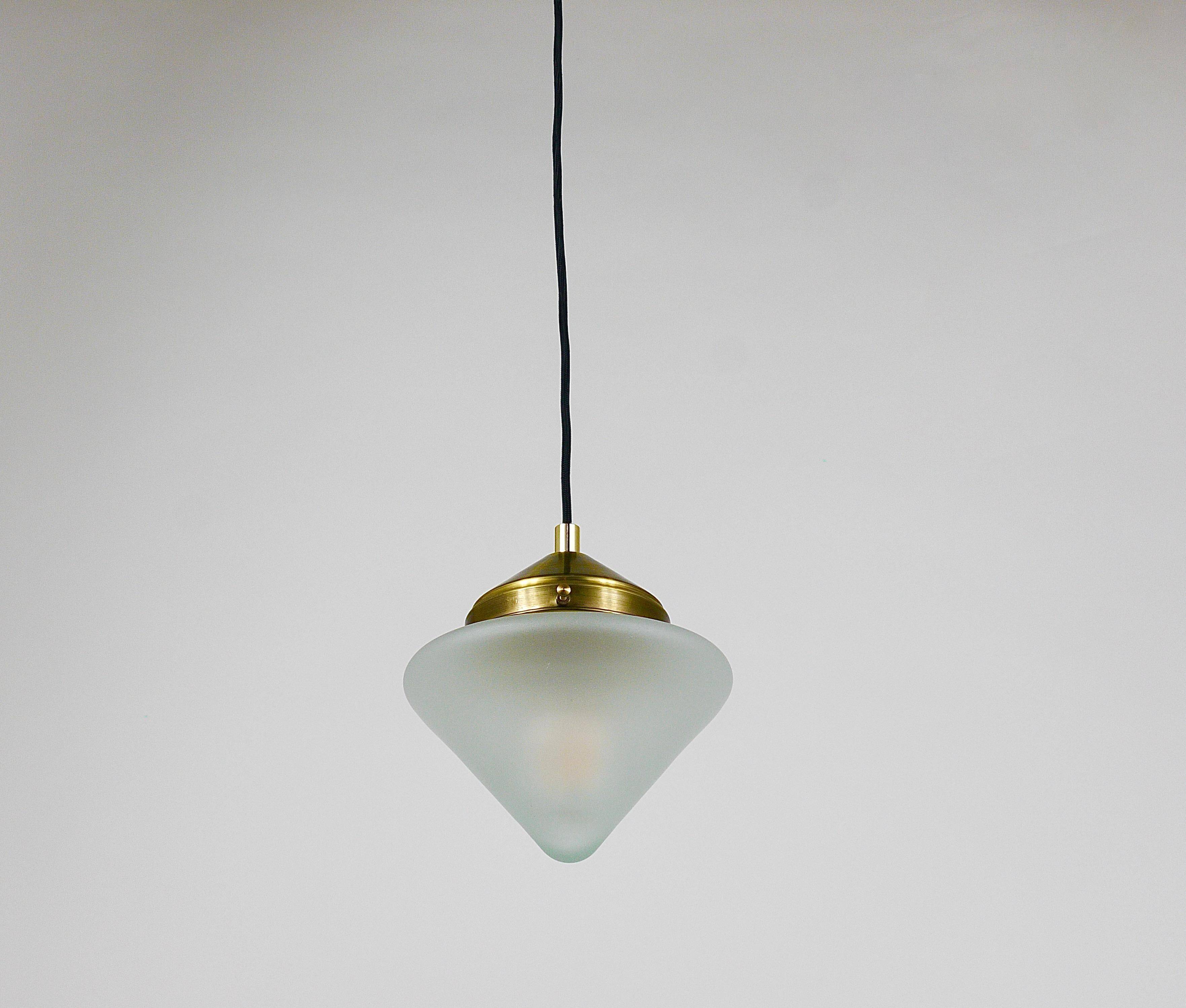 Up to 7 Art Deco brass pendant lights with conical glass shades, Vienna 1930s.