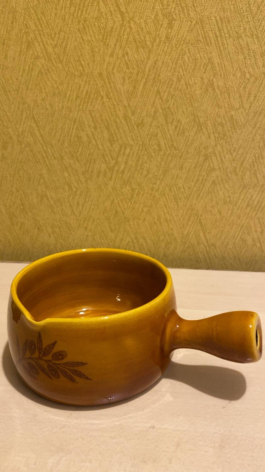 Glazed yellow earthenware fondue pot