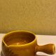 Glazed yellow earthenware fondue pot