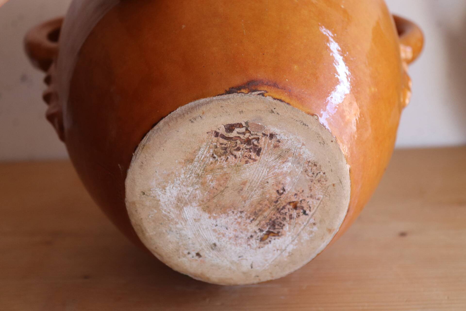 Old honey-glazed pot with two handles