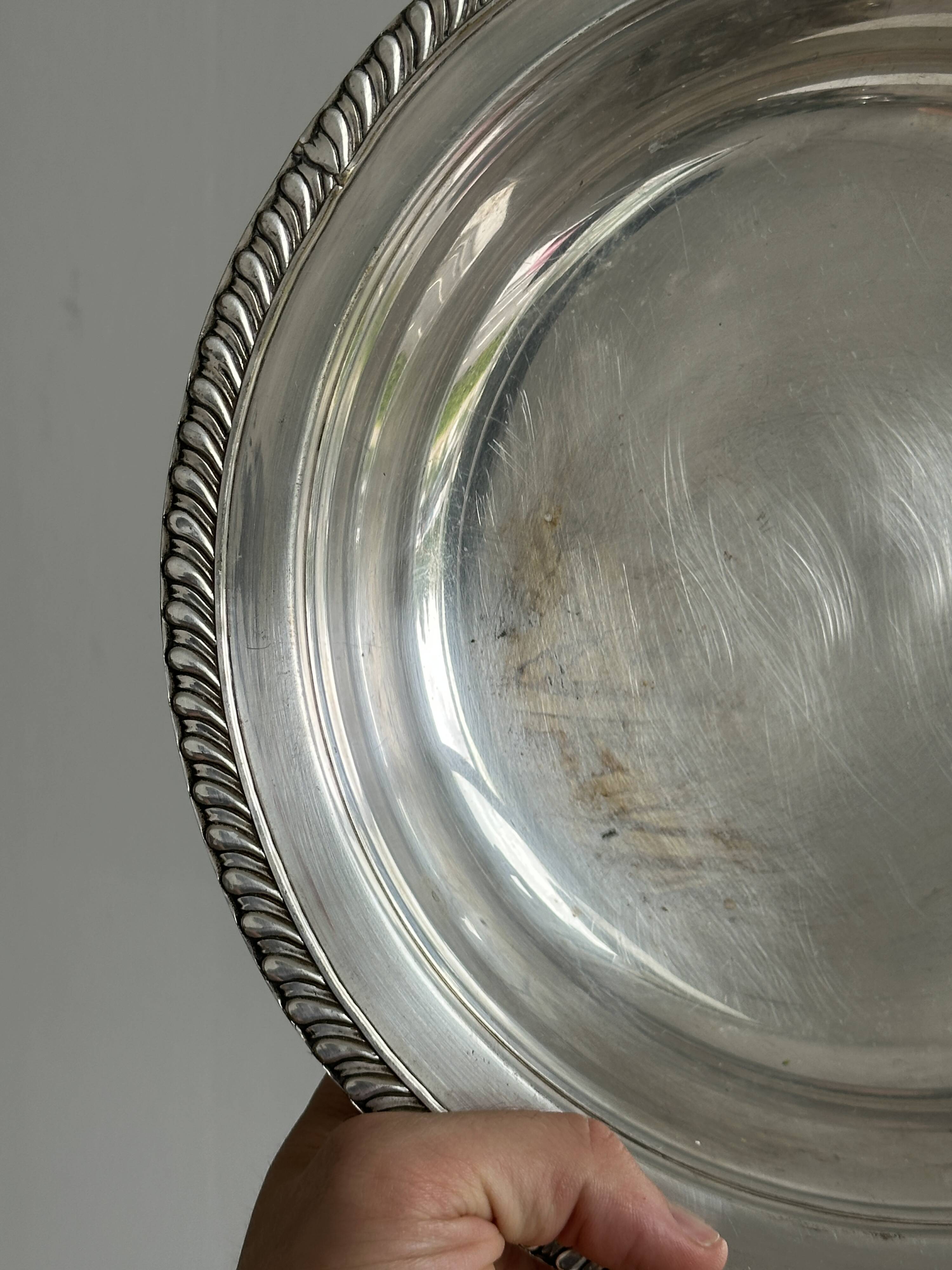 Antique round salad bowl or dish in shiny silver metal