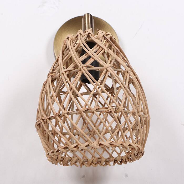 Golden bohemian wall lamp in woven rattan