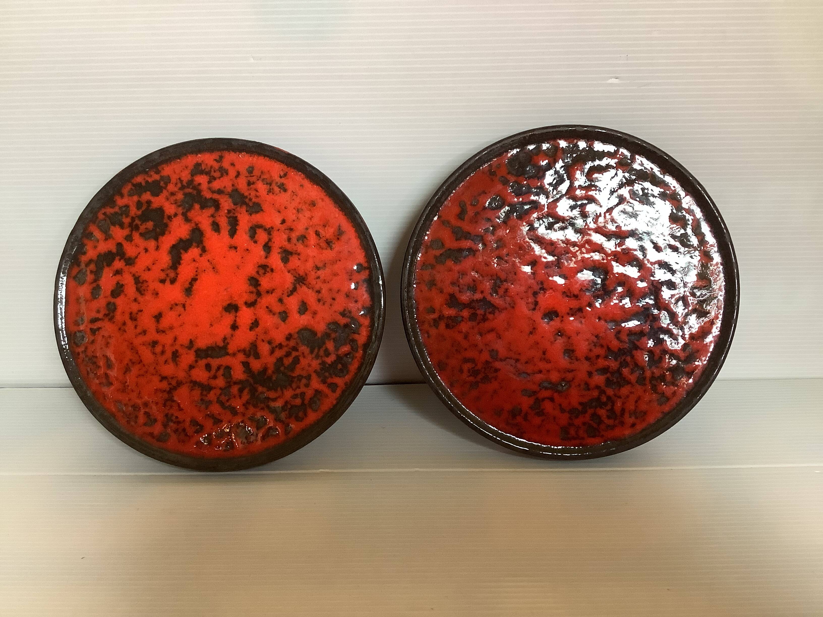 Pair of red speckled ceramic trivets
