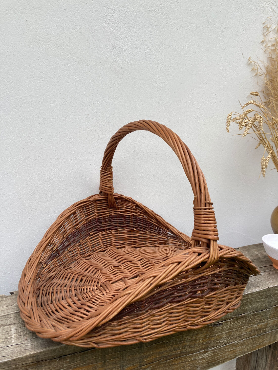 Large old woven wicker log basket