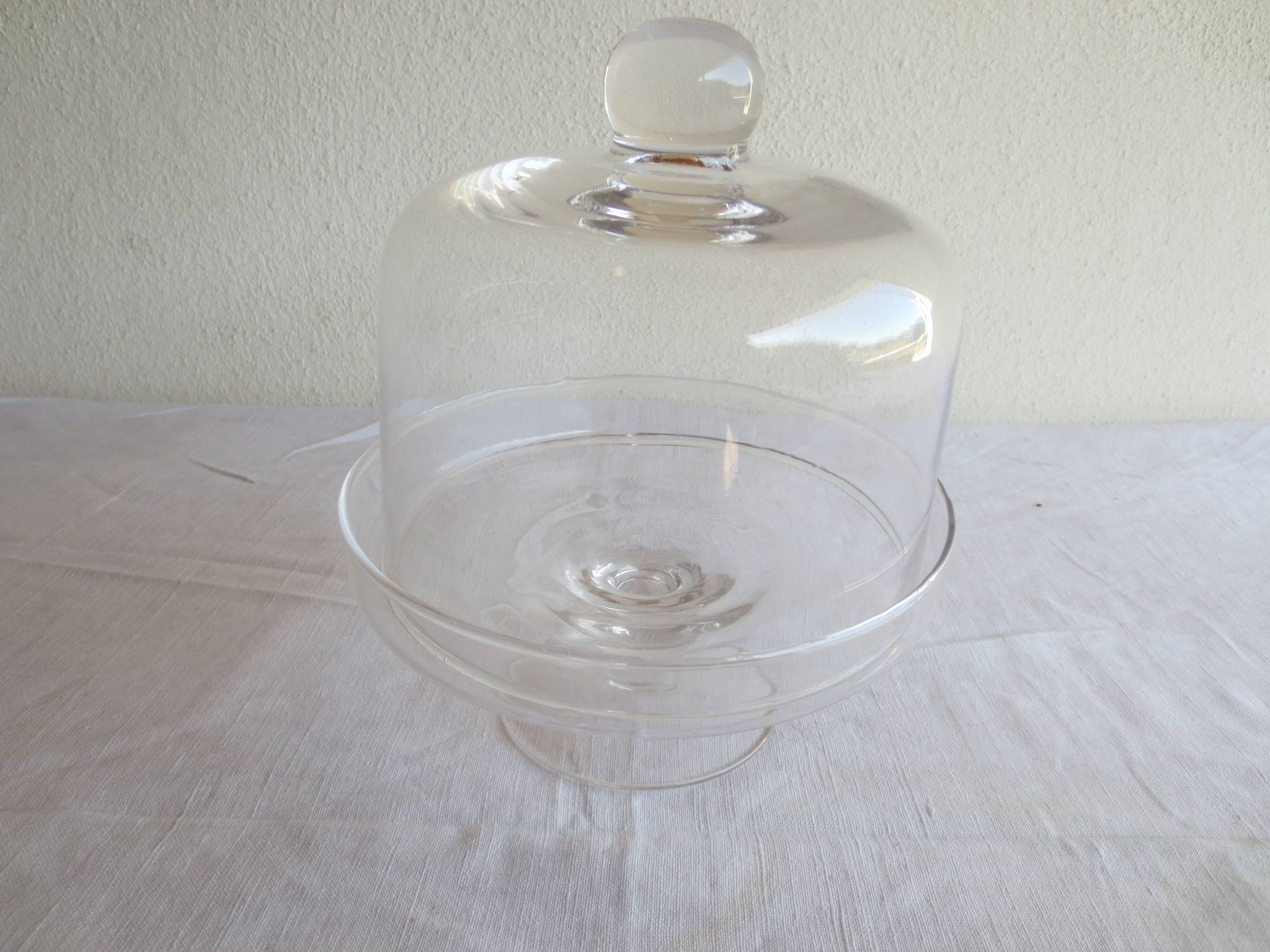 Old glass cake dome on a stand