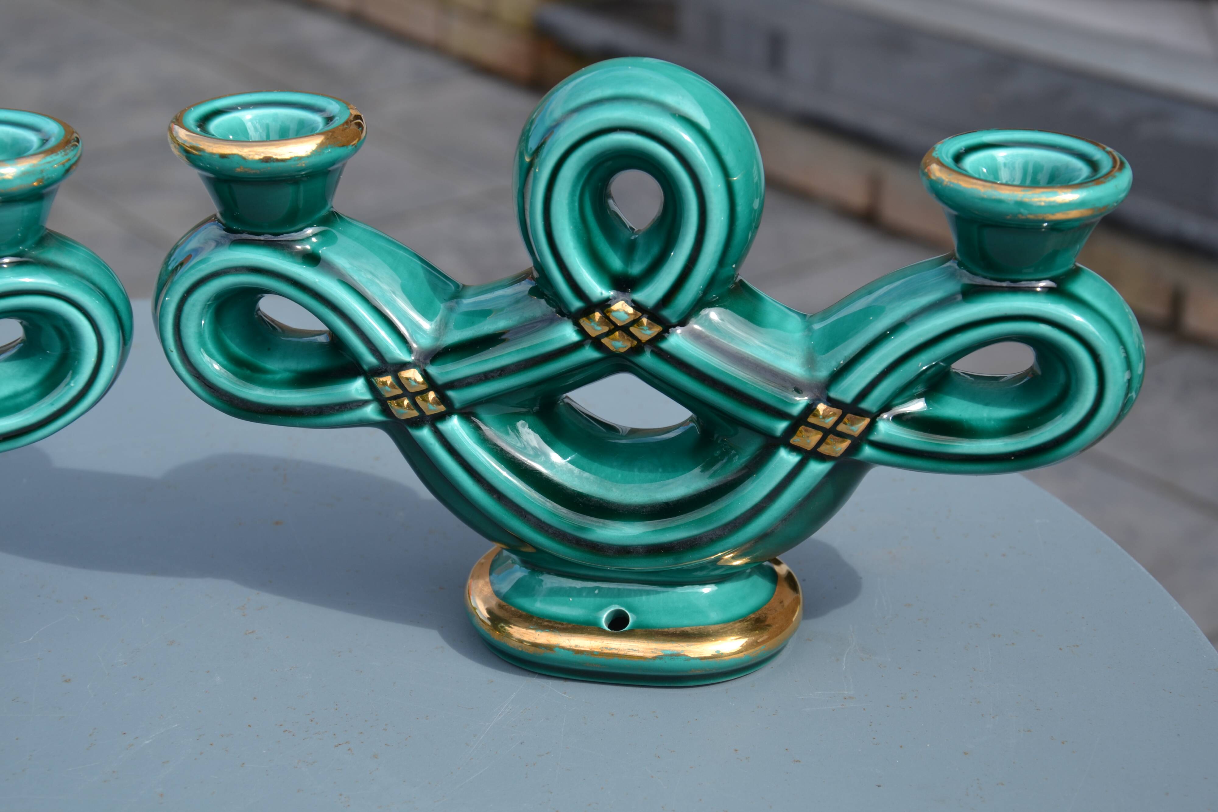 Two green ceramic candlesticks from the 1930s-1940s.