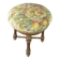Old upholstered piano stool