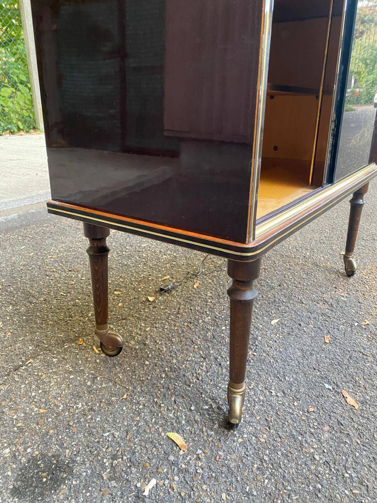 Illuminated bar cabinet Hollywood Regency black and gold 1970