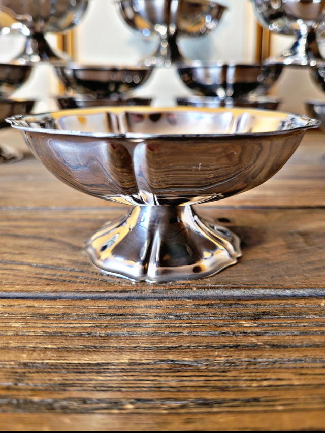 Stainless steel ice bowls by Guy Degrenne, low bowls in the shape of a flower.