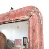 Old mirror in red wood
