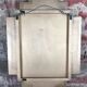 Art deco style "miami" mirror in patinated gilded wood 80x52cm