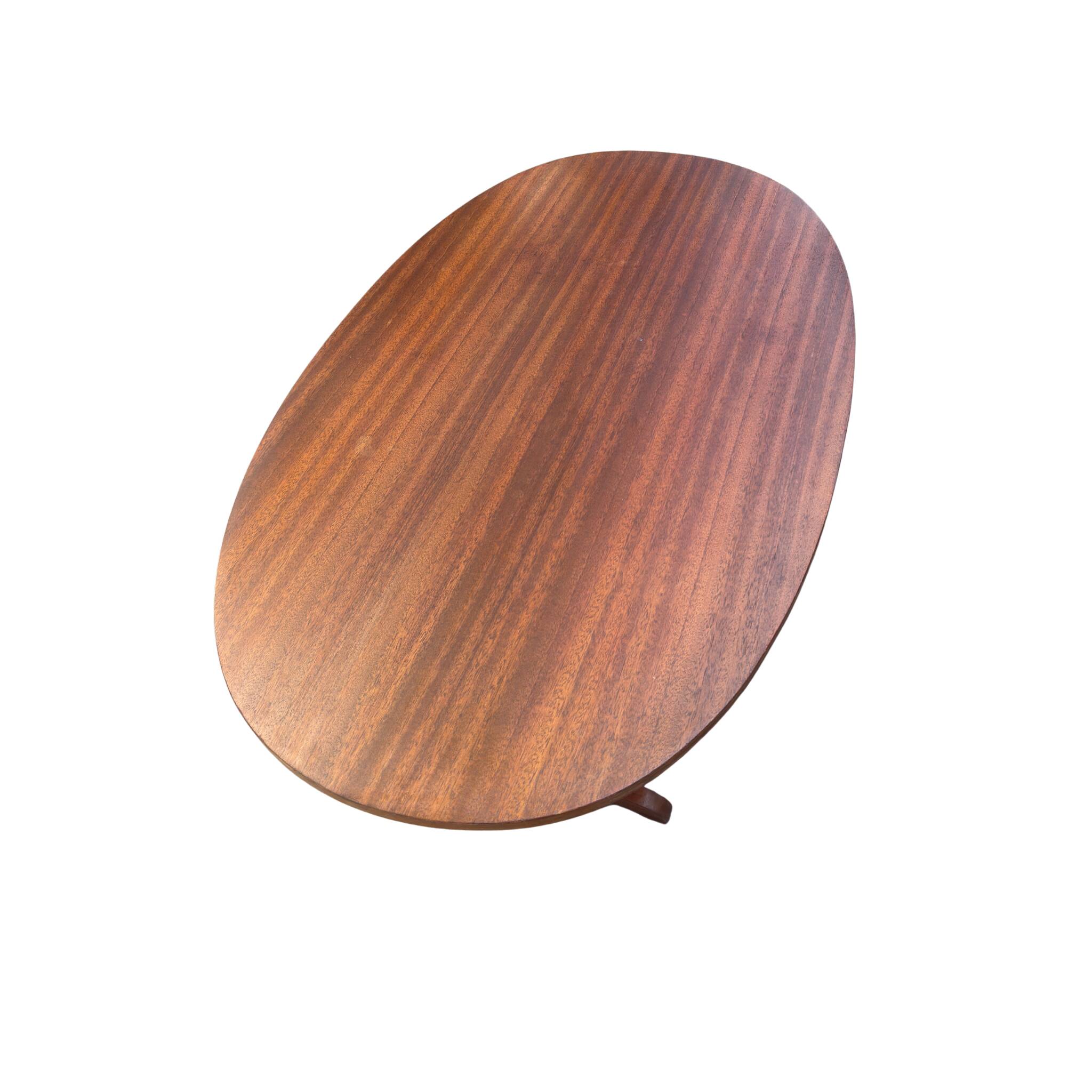 Oval folding table – mahogany veneer – V-shaped base – France, circa 1970