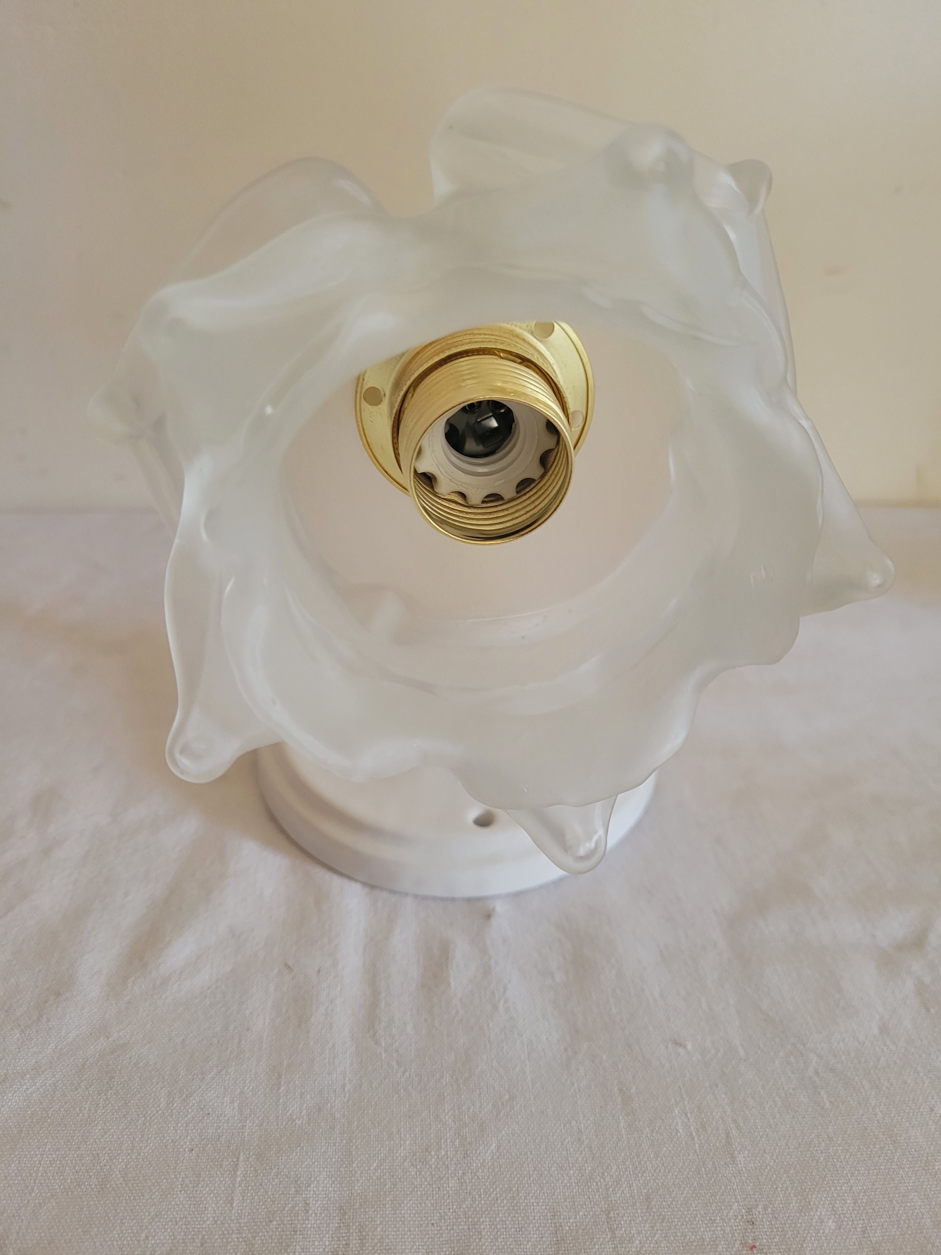Brass flower and frosted glass sconce