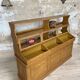 Wooden hardware cabinet painted with wood effect, circa 1940.
