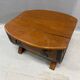 Oak barrel-shaped storage chest with black metal straps, 1930s-1940s.