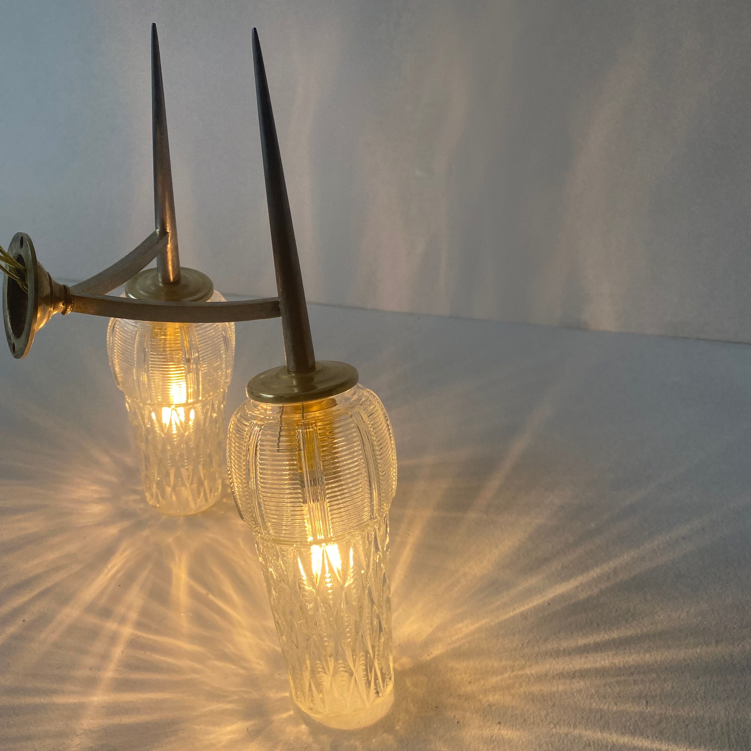 Old double wall lamp in vintage molded glass