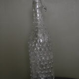 Clear bottle with pegs