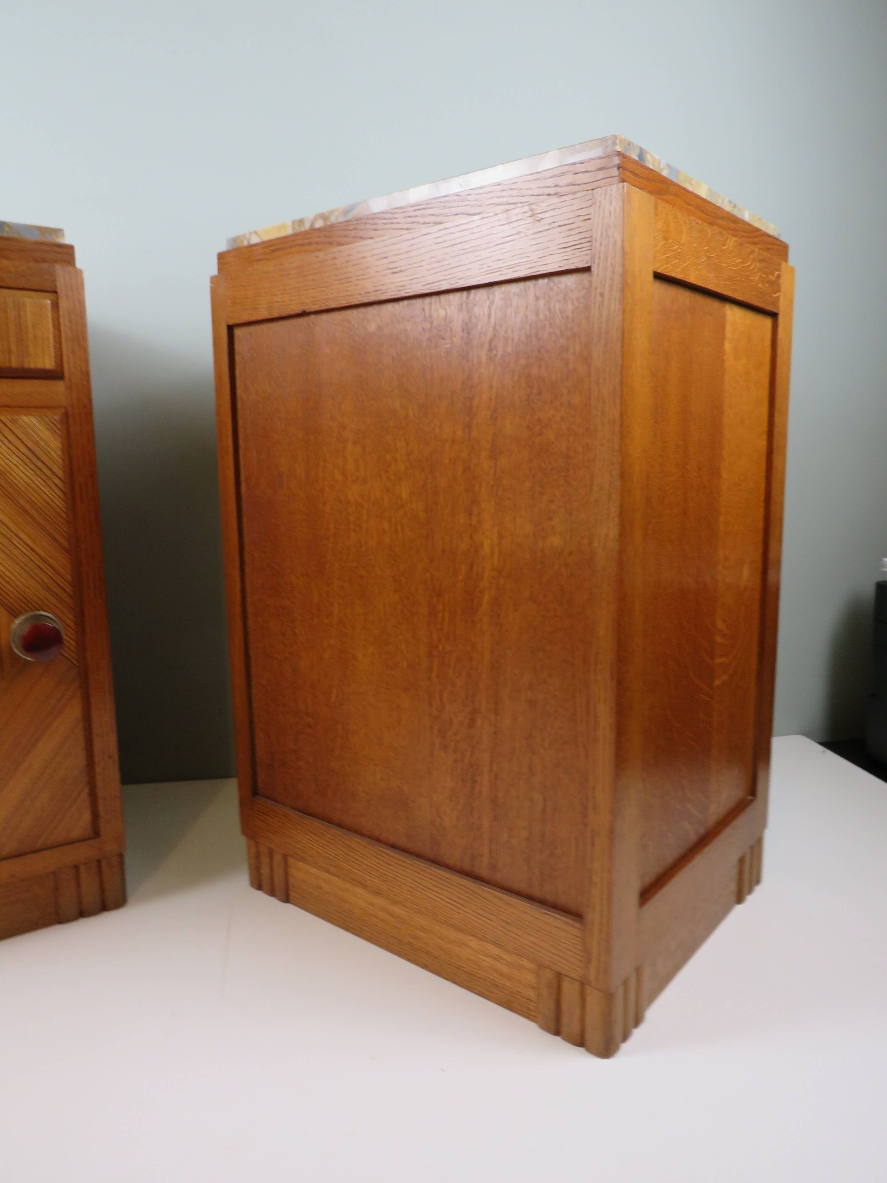 Art Deco bedside tables in oak with an inlaid marble top.