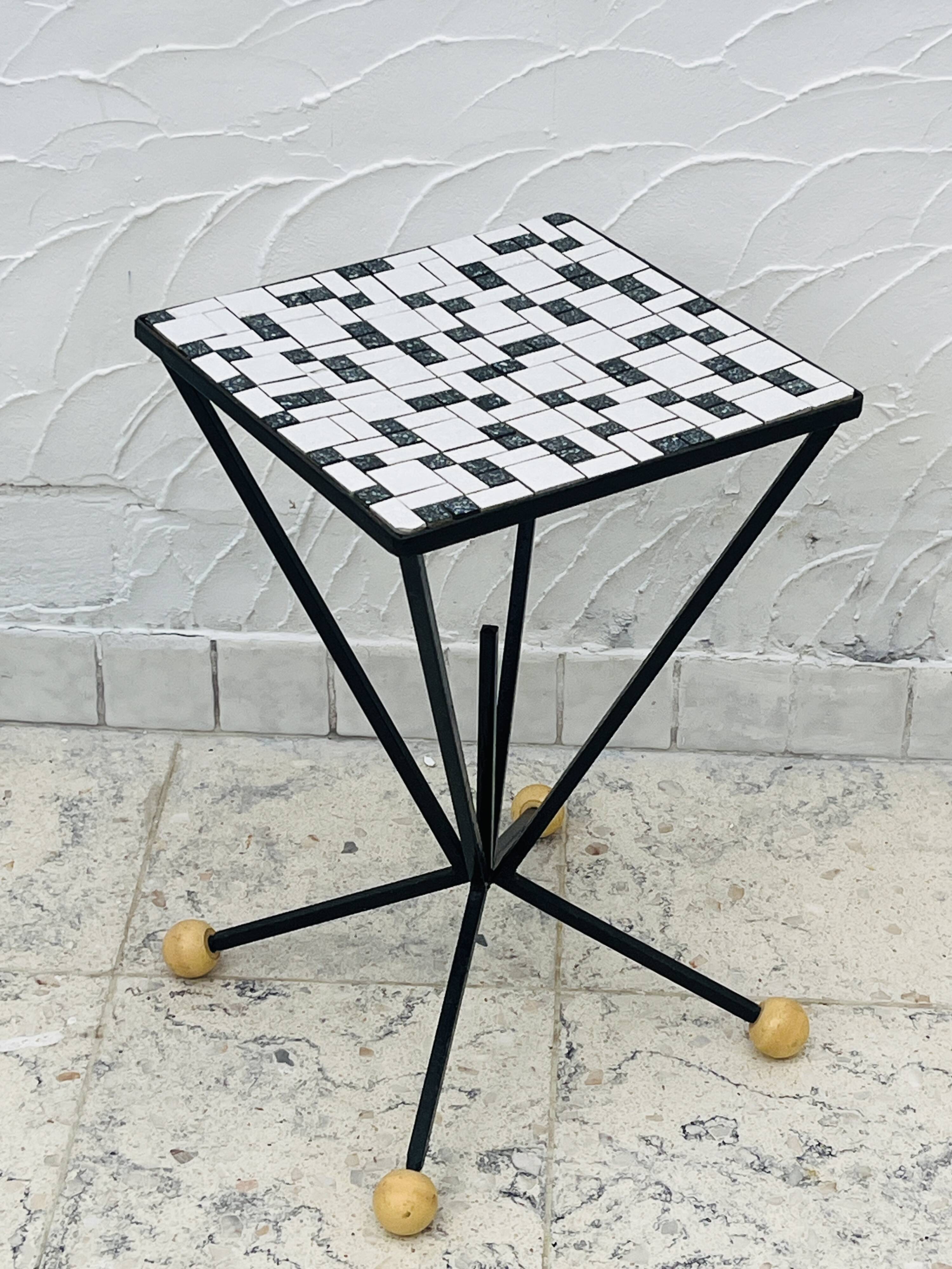 Wrought iron stela and black and white tiled top from the 1960s.