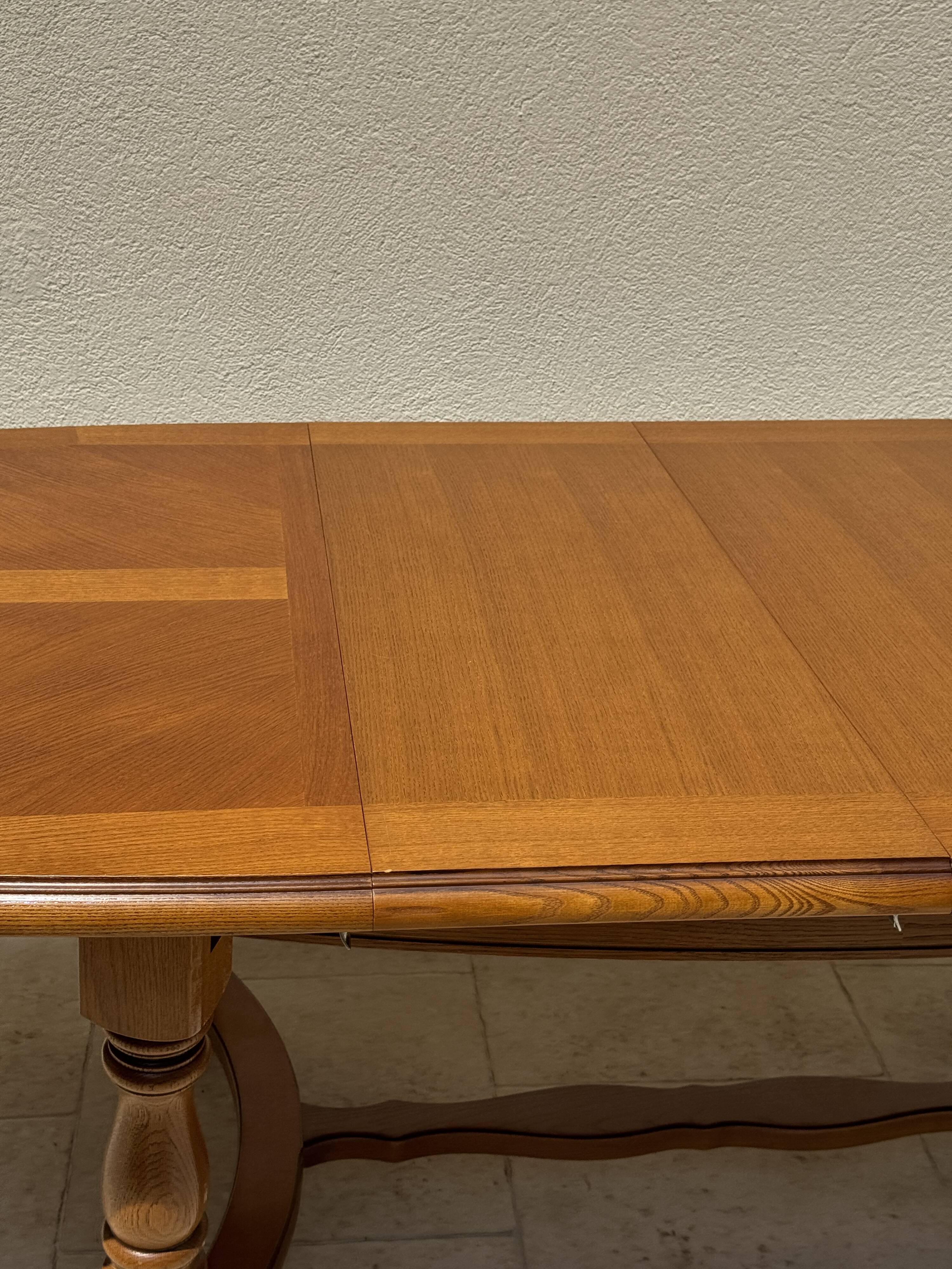 Oak dining table, oval living room table with two extensions.