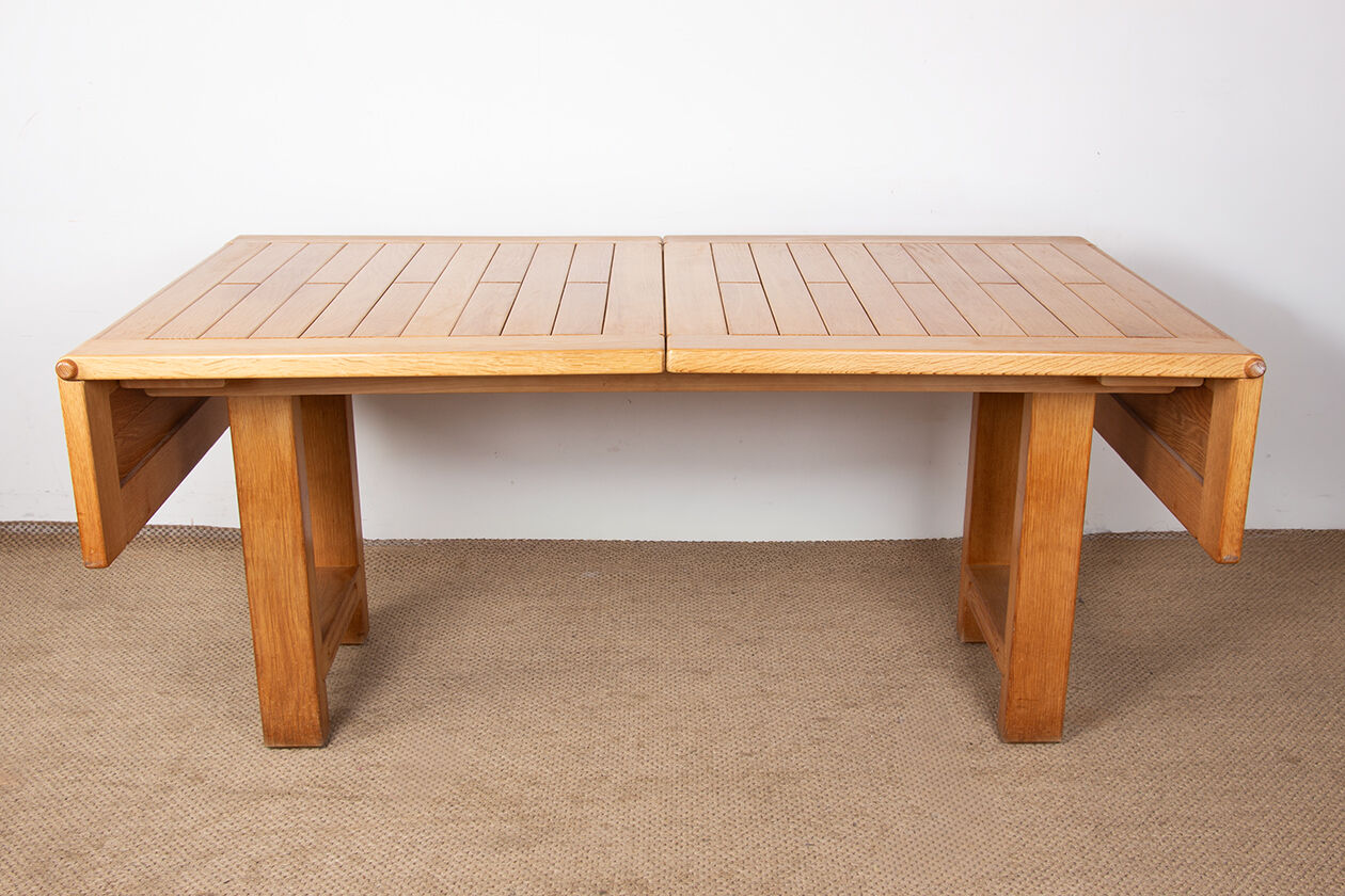 Large extendable dining table in solid oak by Guillerme and Chambron.