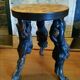 Brutalist tripod stool made from vine stumps.