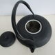 Asian teapot in black cast iron