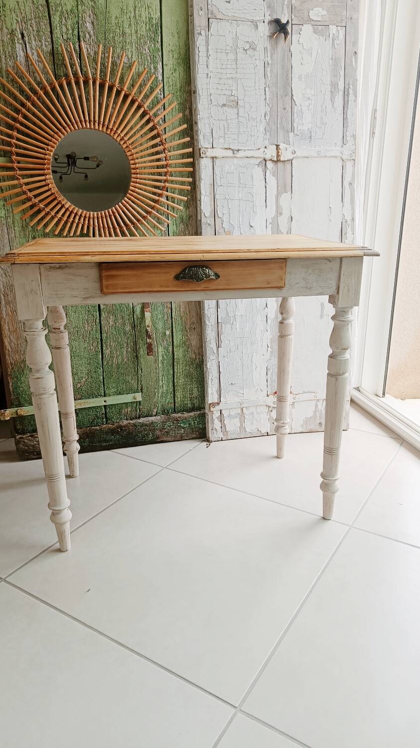Antique wooden desk with a patinated base