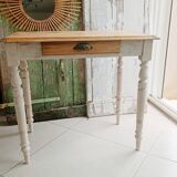 Antique wooden desk with a patinated base