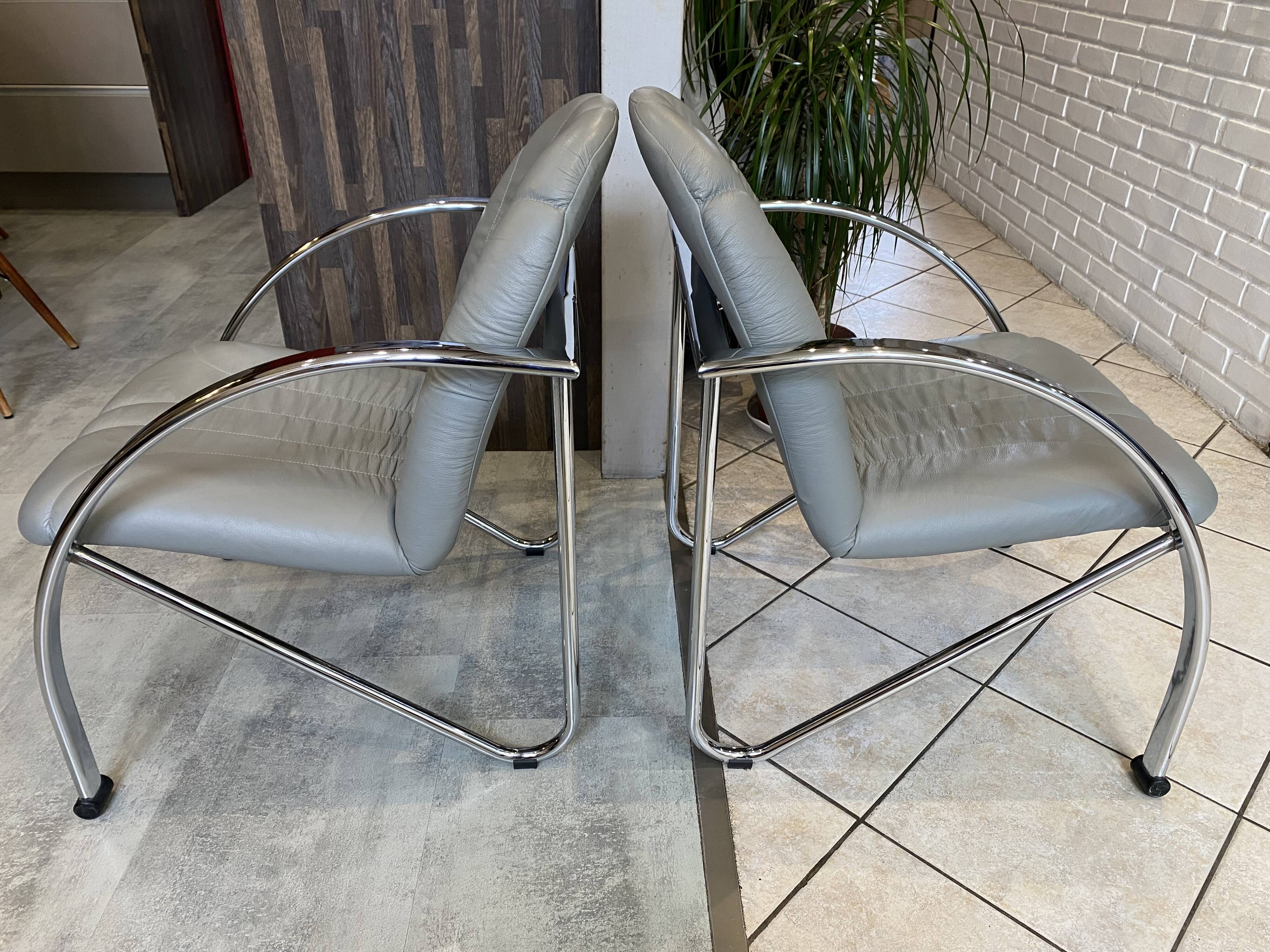 Pair of Souvignet armchairs, grey leather, chrome, 1980.