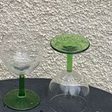 5 transparent glass glasses and green glass vase go