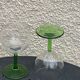 5 transparent glass glasses and green glass vase go
