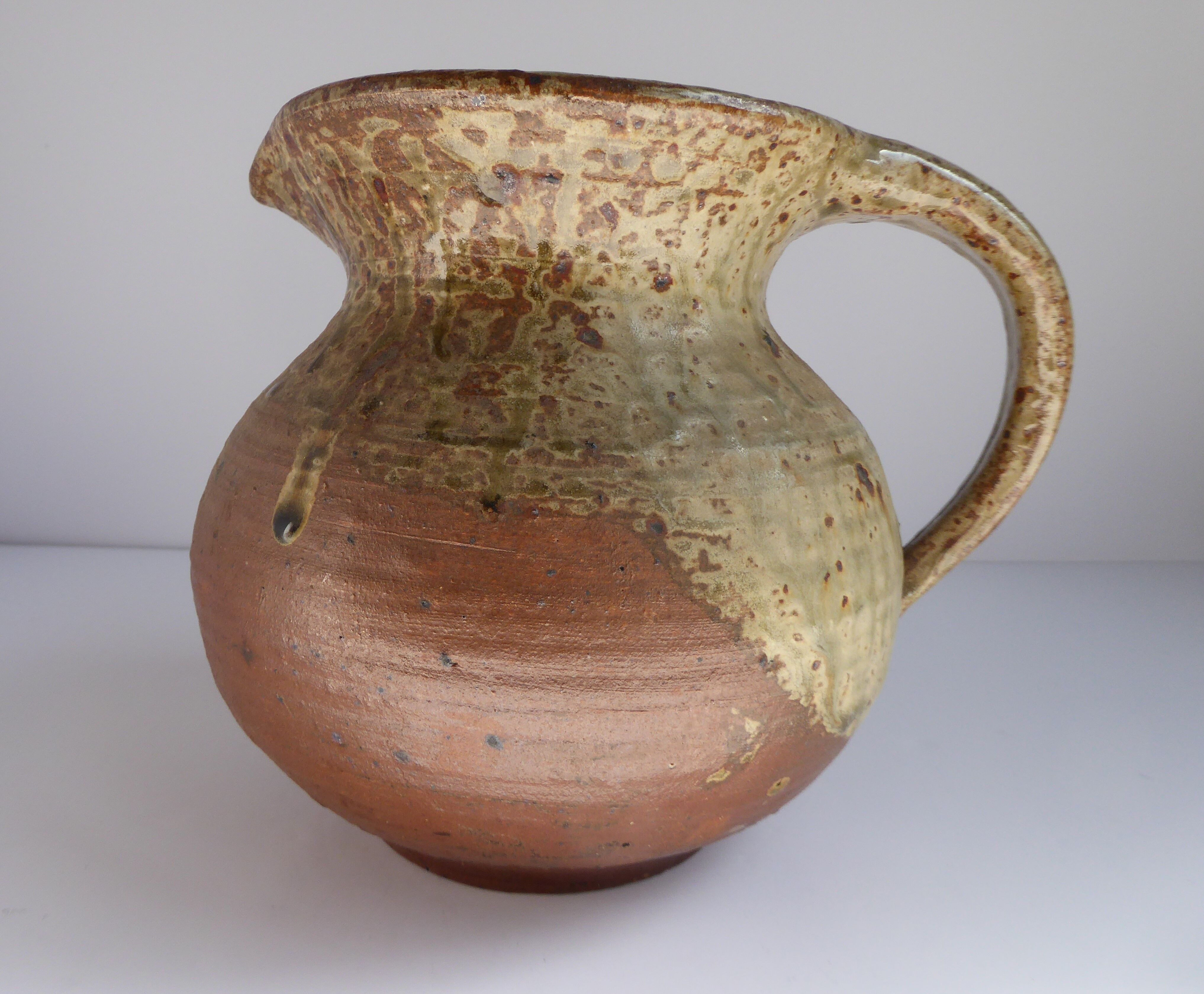 Signed vernissé sandstone pitcher