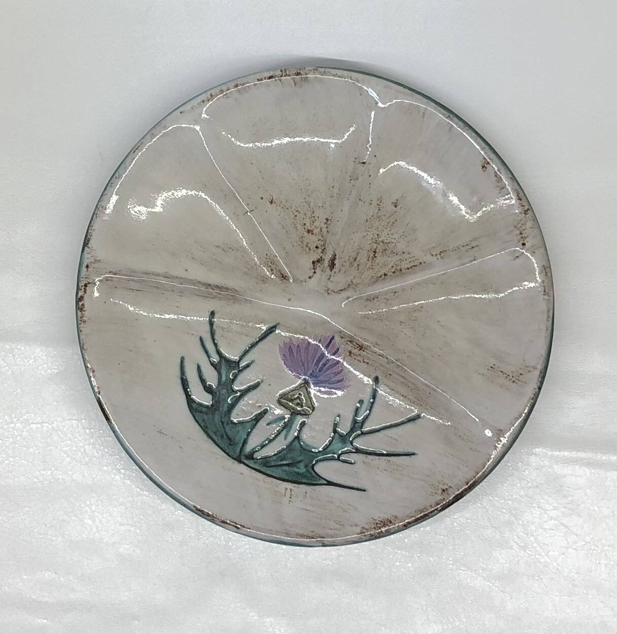Thistle-themed decorative plate by Daniel Étienne in Vallauris