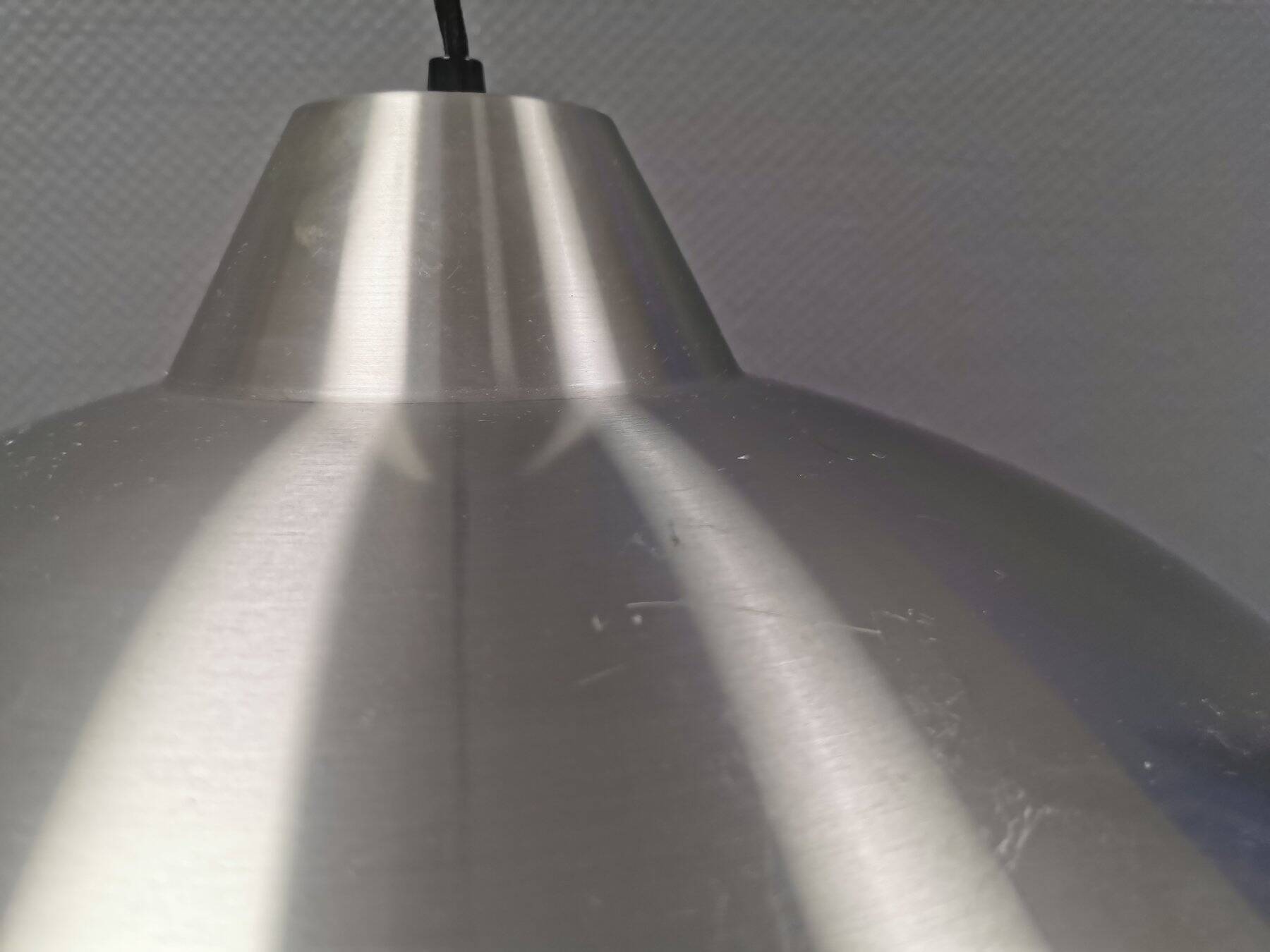 Slim silver-colored hanging lamp with a large diameter. Denmark 1980s