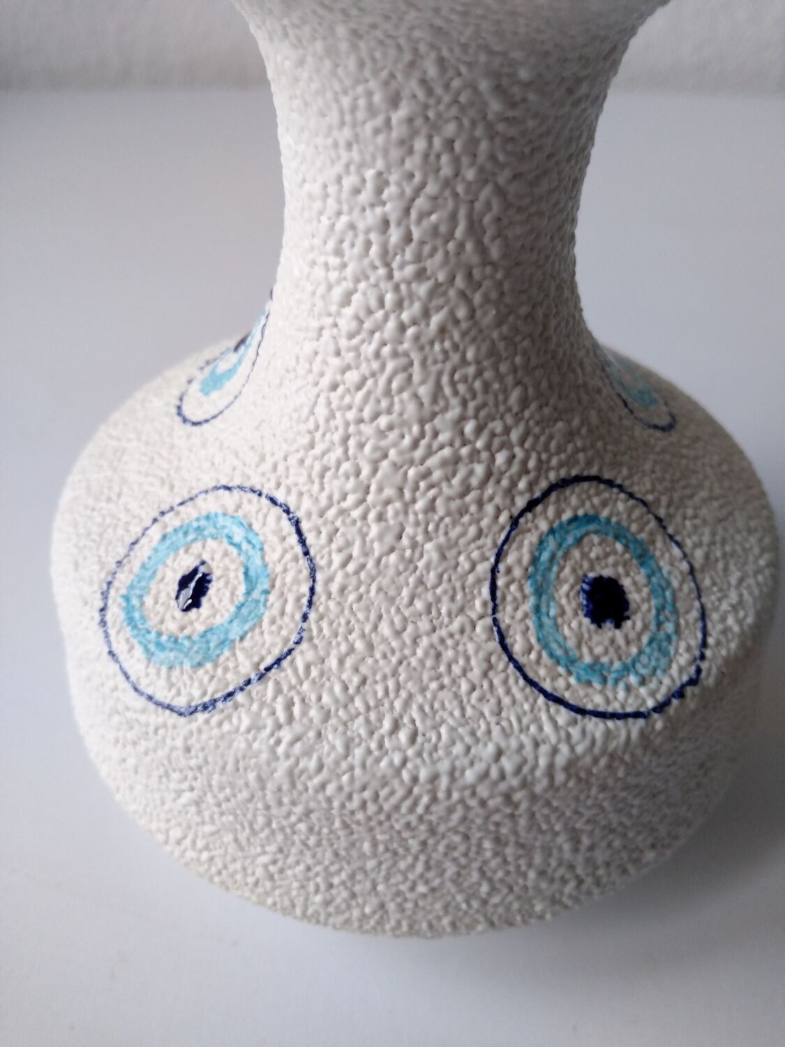 White and blue ceramic vase with italian relief