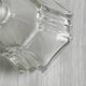 Petit flacon en verre facetté transparent