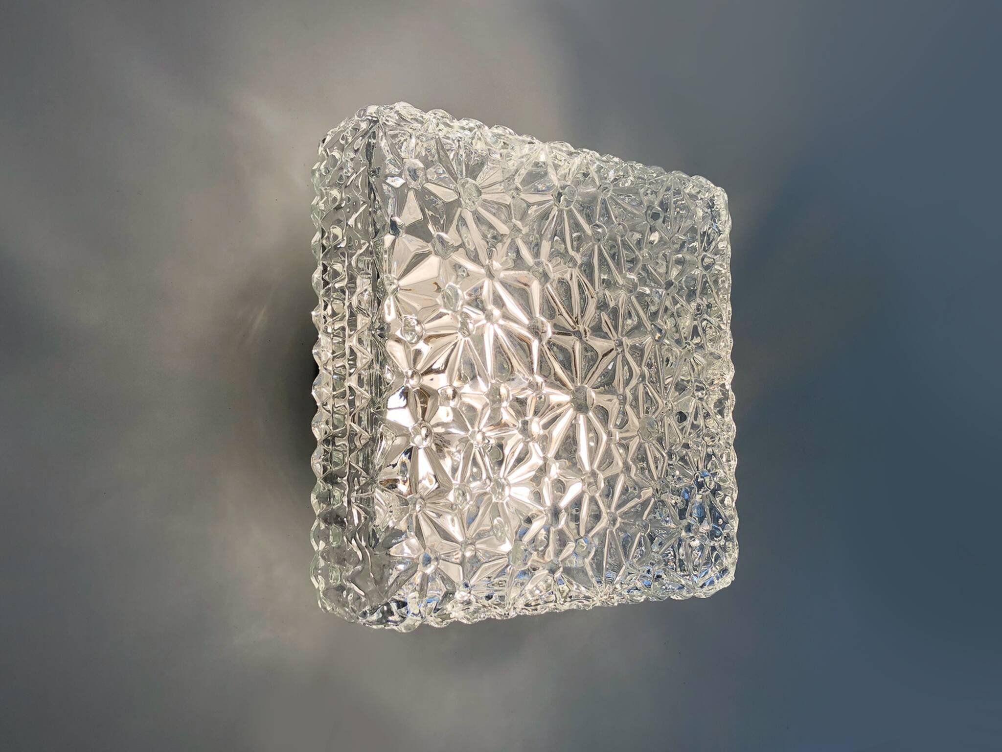 Wall lamp or ceiling light in glass and metal from the 50s and 60s.