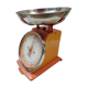 Orange metal household scale from 1970