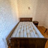 Old pressed sheet metal bed and its bedside table