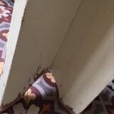 A rough wooden stool patinated by time