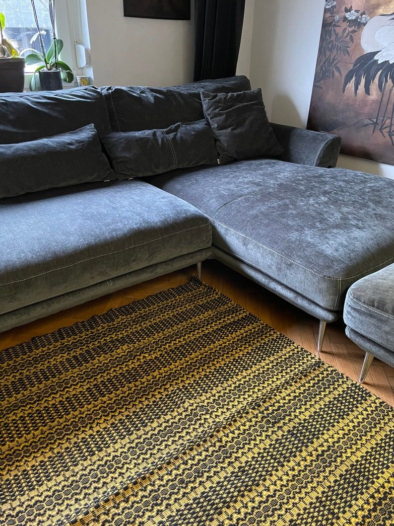 Romanian vintage carpet black design on a yellow background