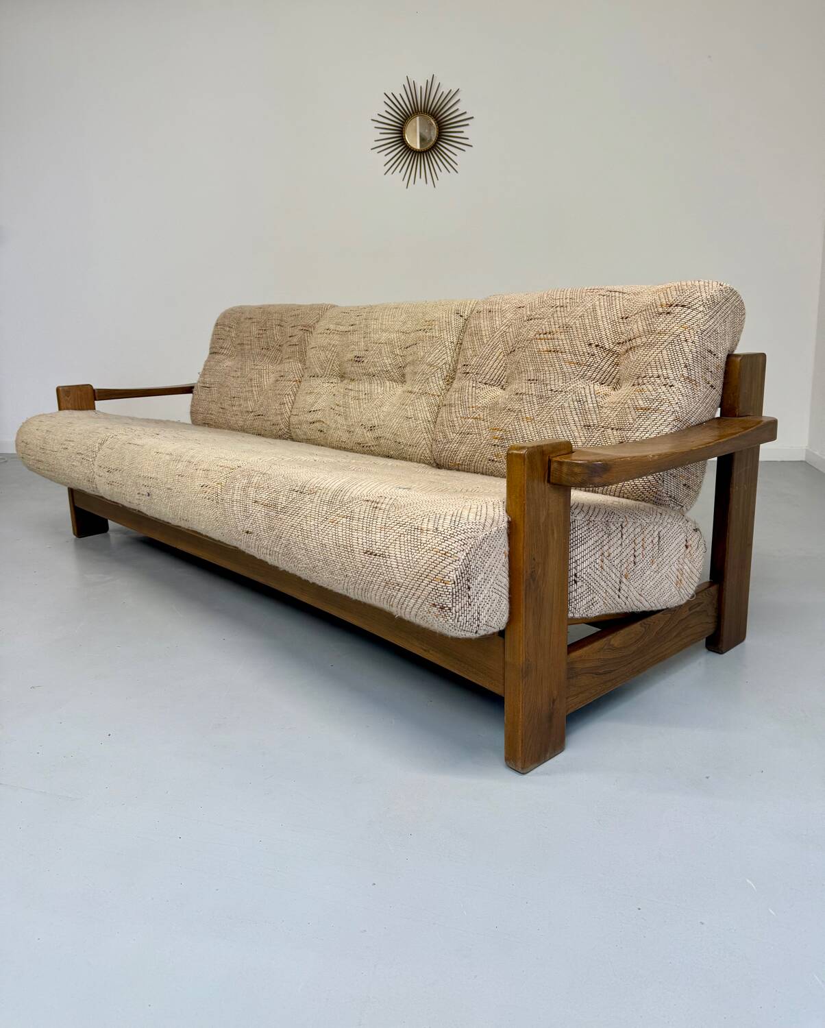 Old 3-seater sofa in solid wood, Maison Regain design, from the 70s.