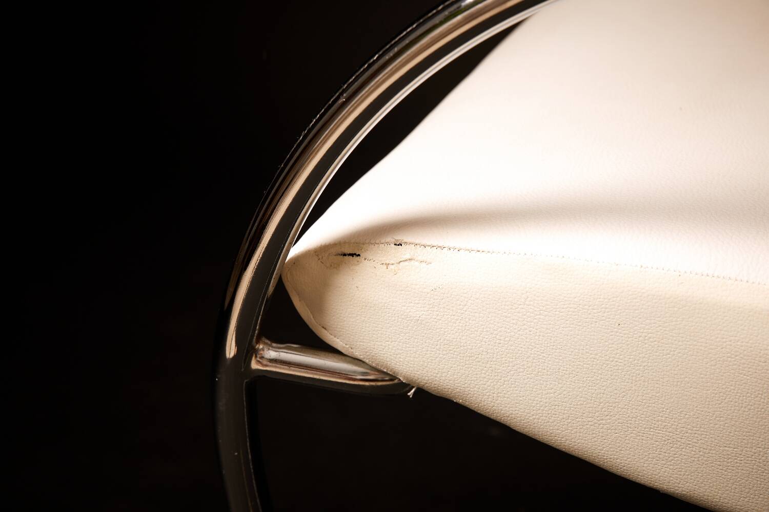 Chrome metal and white sky designer armchair