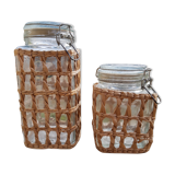 Pair of glass jars and rush