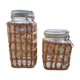 Pair of glass jars and rush