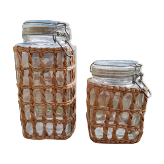 Pair of glass jars and rush