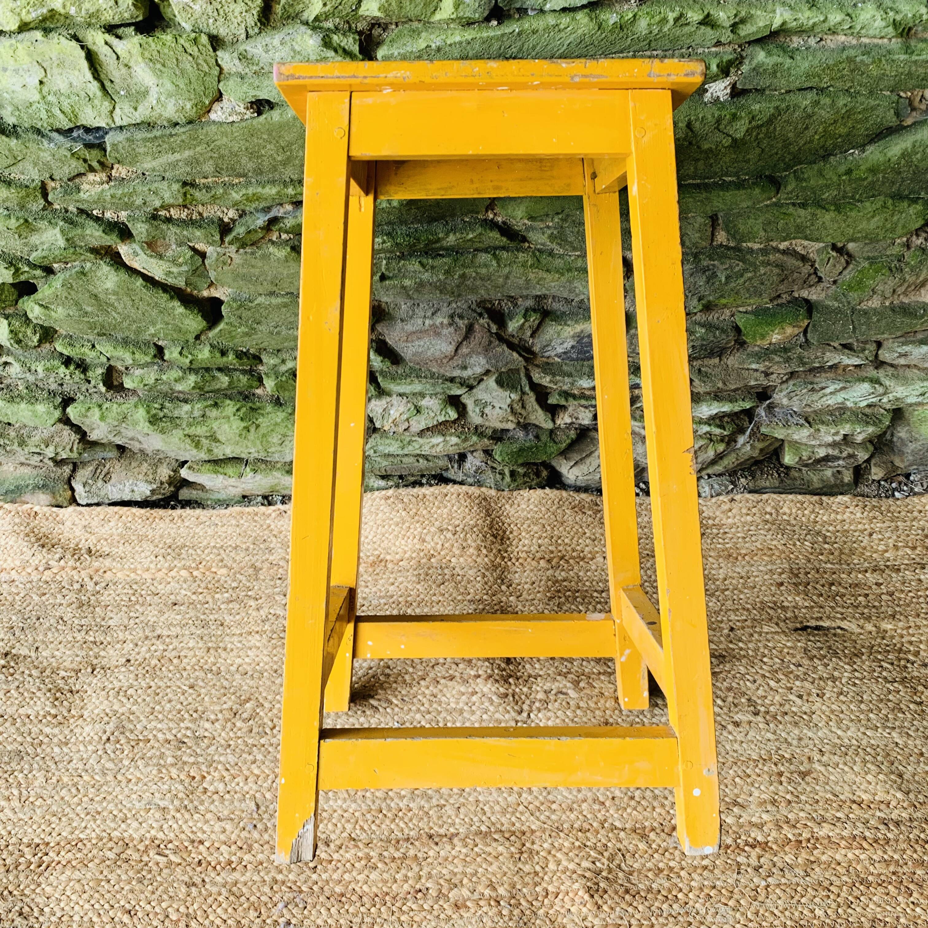 Yellow wooden high stool