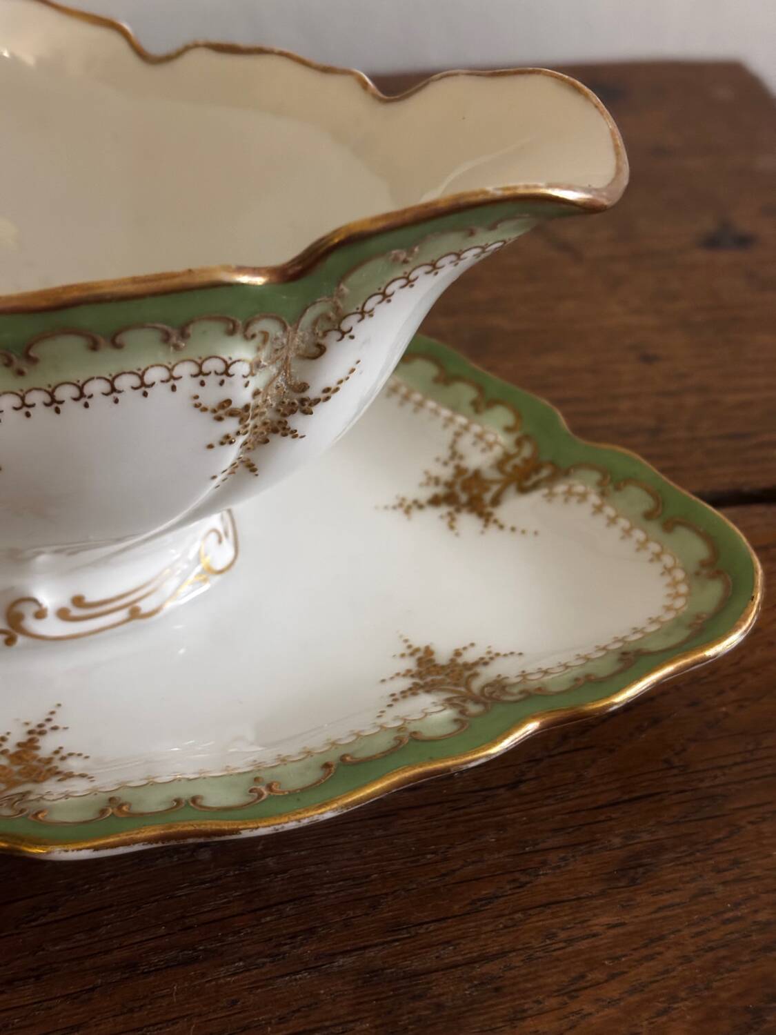 Vintage green Limoges porcelain gravy boat with gilt trim