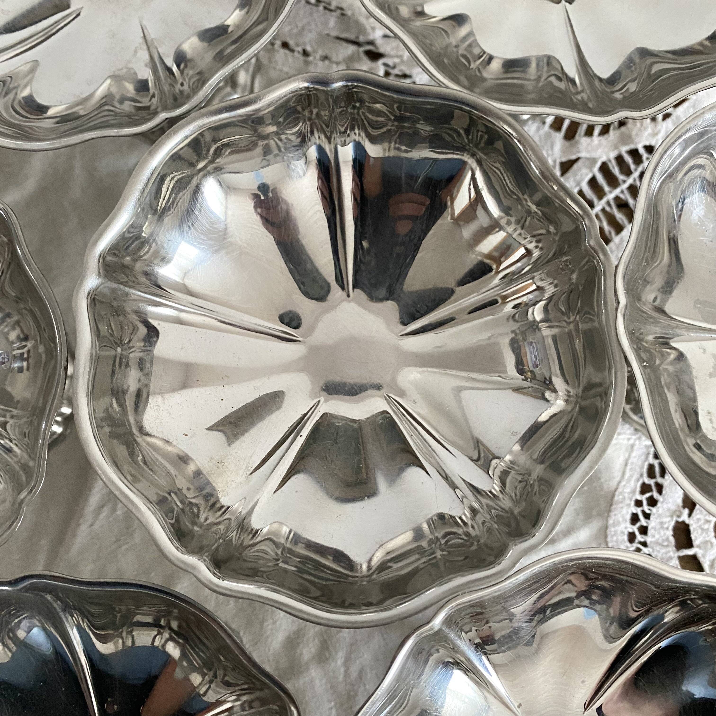 Vintage stainless steel cups on foot